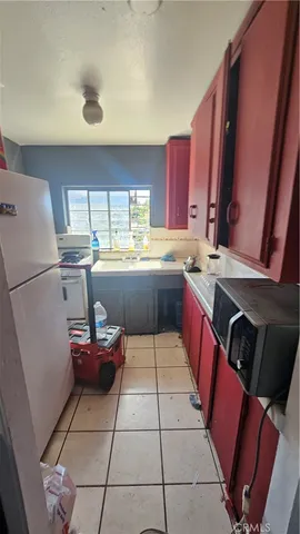 a kitchen with stainless steel appliances a sink and a refrigerator