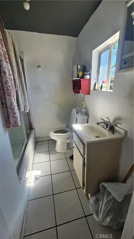 a room with a washing machine and sink