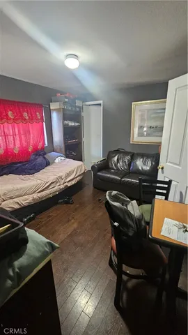 a bedroom with furniture and a window