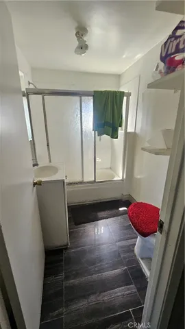 a view of entryway with furniture and wooden floor