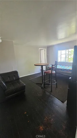 a room with chairs and window