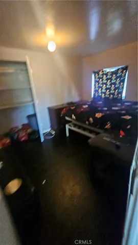 a bed sitting in a room next to a window