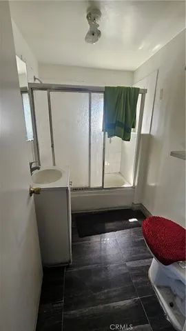 a kitchen with a stove a sink and a refrigerator