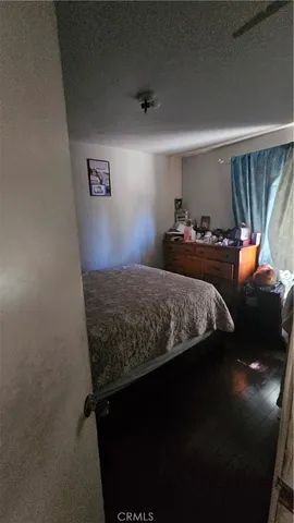 a view of a backyard with table and chairs and potted plants