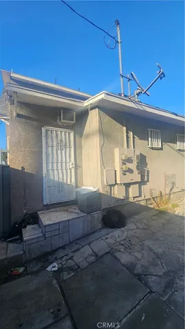 a view of a house with a tree