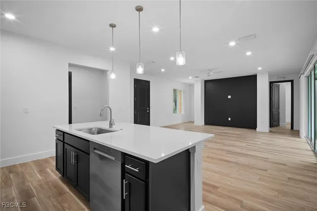 a kitchen with a sink and a refrigerator