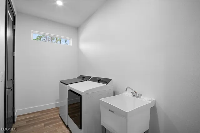 a utility room with dryer and washer