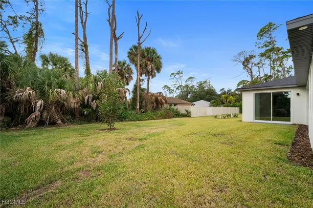 a view of a yard in front of a house