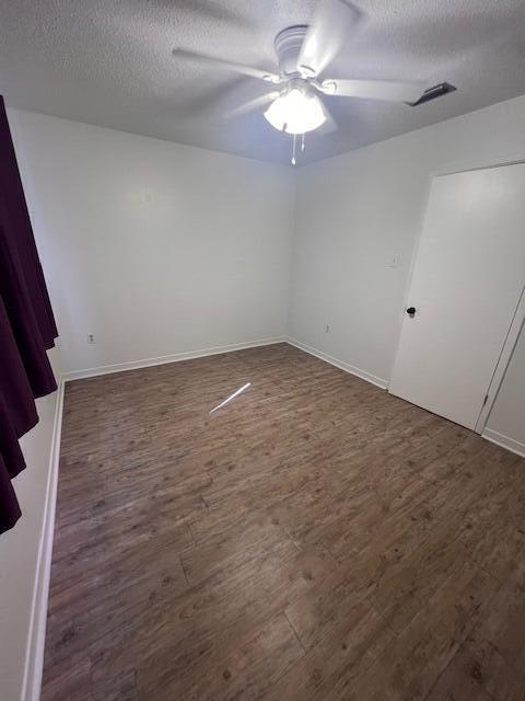 1925 Esplanade Street Navarre, FL 32566 - Photo 11 of 22 an empty room with a chandelier fan and windows