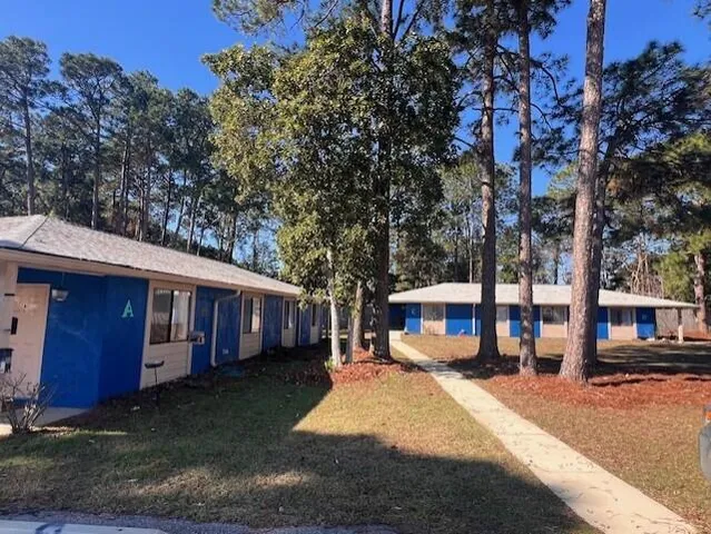 a view of a house with a yard