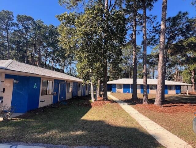 1925 Esplanade Street Navarre, FL 32566 - Photo 2 of 22 a view of a house with a yard