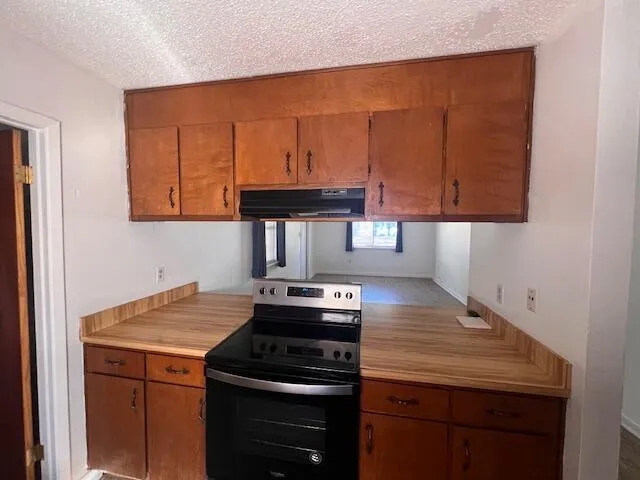 a kitchen with a stove and a microwave