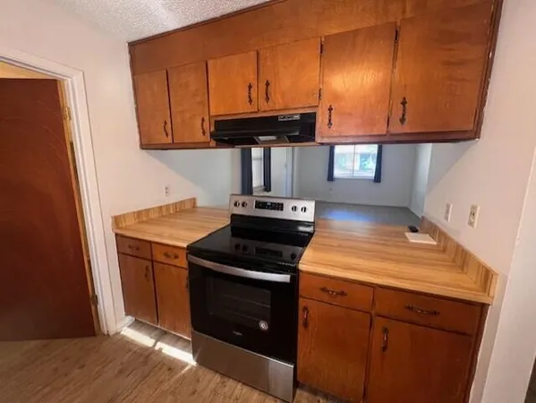 a kitchen with a stove and a microwave