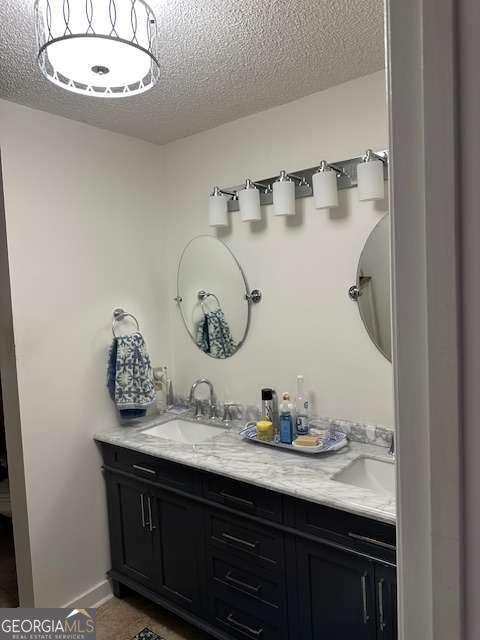 2008 Rutland Road, Unit 10 Tifton, GA 31793 - Photo 28 of 32 a bathroom with a granite countertop sink and a mirror
