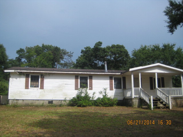 2552 Graham Road Gray, GA 31032 - Photo 1 of 1 a front view of a house with a garden