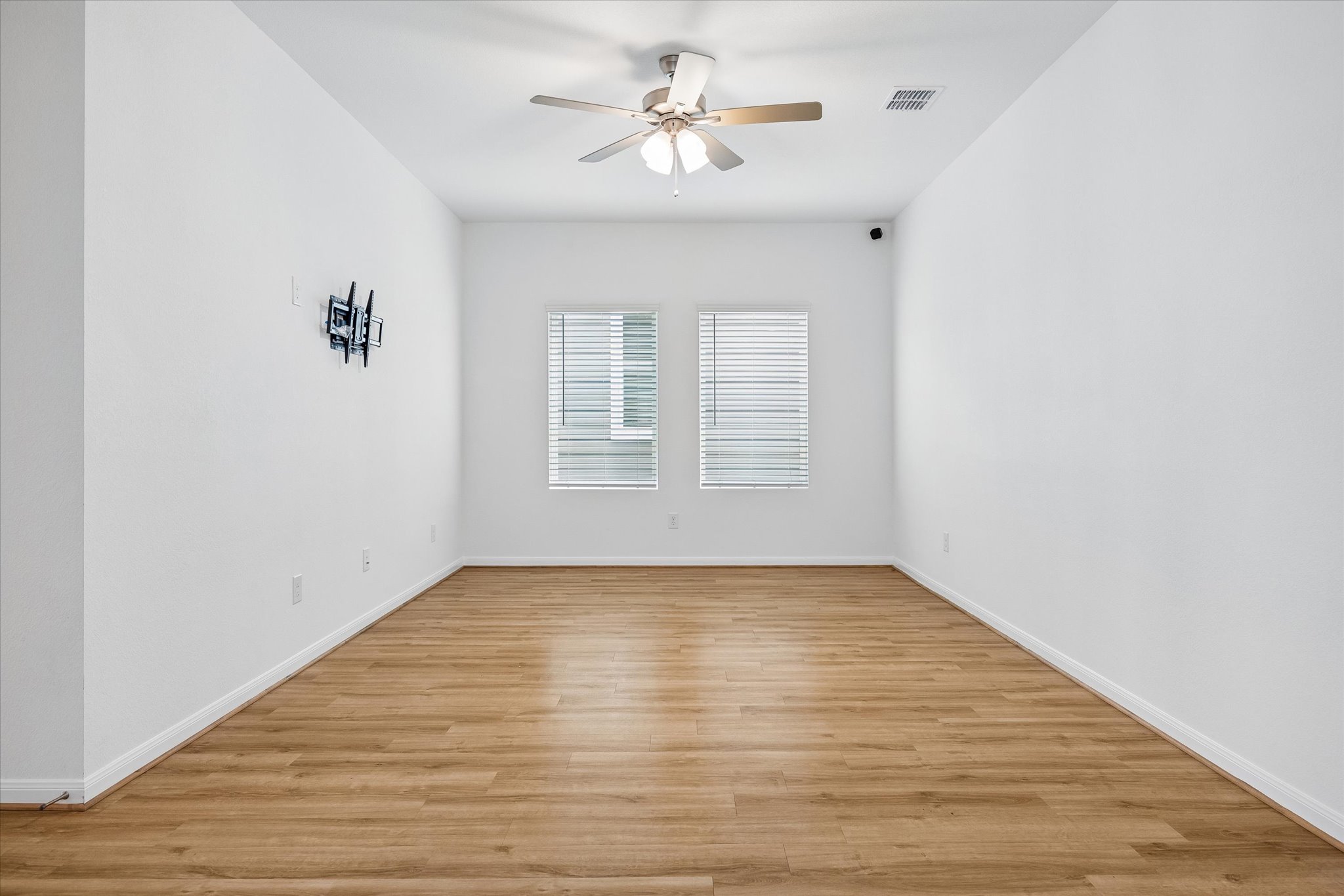 157 LT Rusty Drive Jarrell, TX 76537 - Photo 7 of 39 a view of empty room with wooden floor and fan