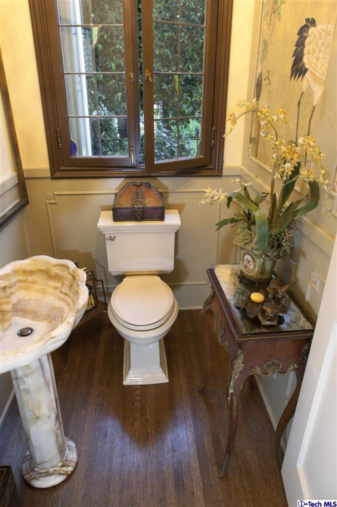 Undisclosed Address San Marino, CA 91108 - Photo 22 of 58 a bathroom with a toilet sink and mirror