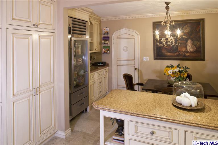 Undisclosed Address San Marino, CA 91108 - Photo 31 of 58 a kitchen with a refrigerator and cabinets