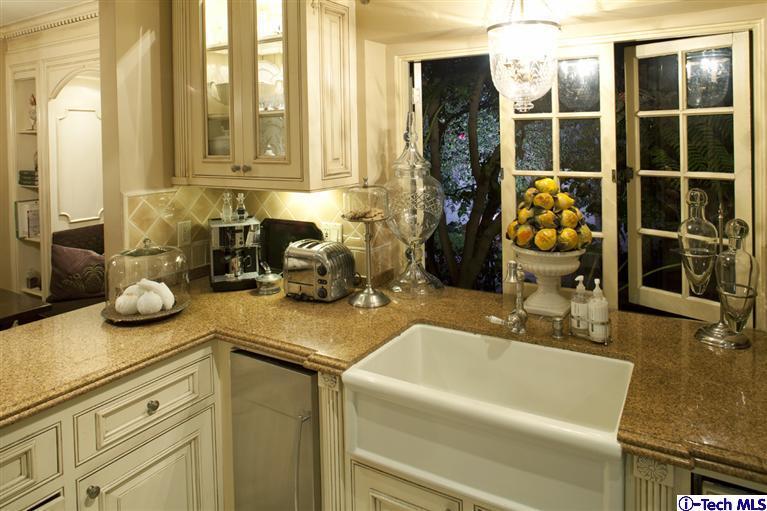 Undisclosed Address San Marino, CA 91108 - Photo 33 of 58 a bathroom with a granite countertop sink and a mirror