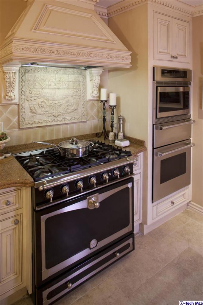 Undisclosed Address San Marino, CA 91108 - Photo 34 of 58 a stove top oven sitting inside of a kitchen