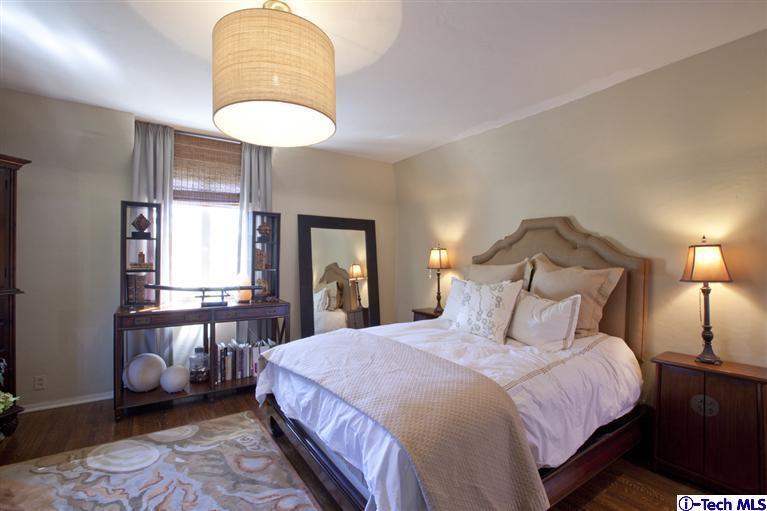 Undisclosed Address San Marino, CA 91108 - Photo 44 of 58 a bedroom with a bed and a chandelier