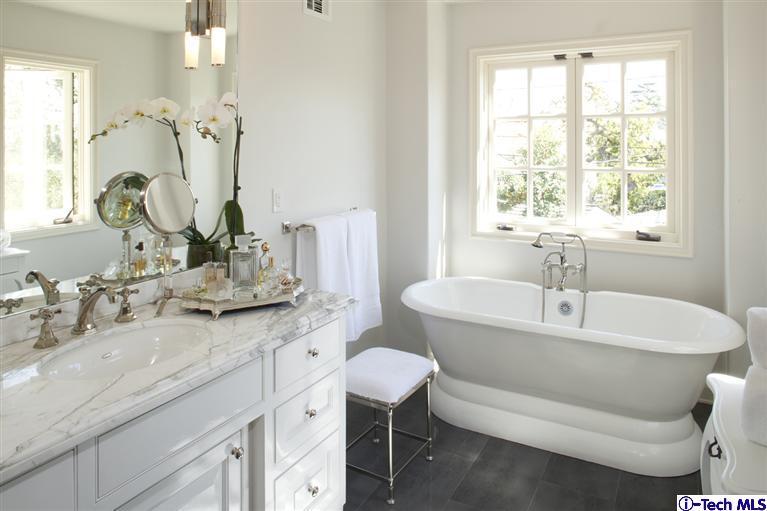 Undisclosed Address San Marino, CA 91108 - Photo 55 of 58 a bathroom with a granite countertop sink and a mirror