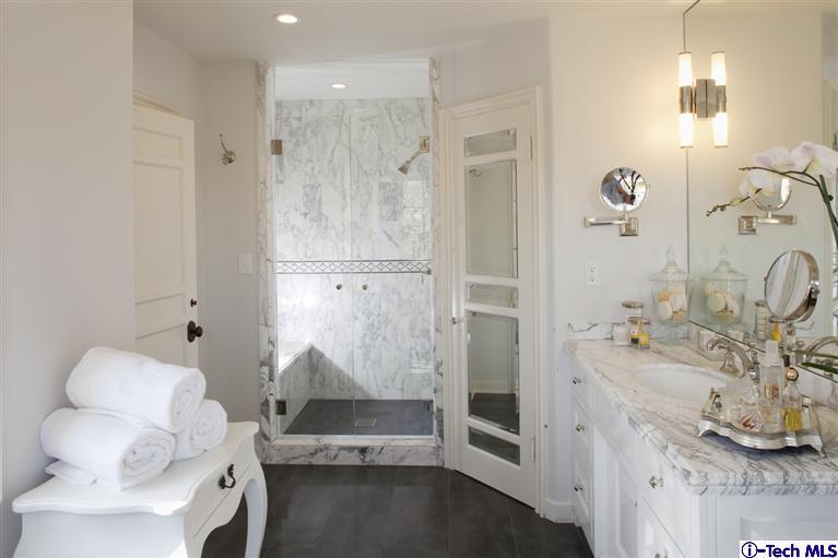 Undisclosed Address San Marino, CA 91108 - Photo 56 of 58 a bathroom with a sink and mirror