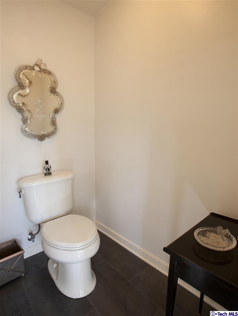 Undisclosed Address San Marino, CA 91108 - Photo 57 of 58 a white toilet sitting next to a bathroom sink