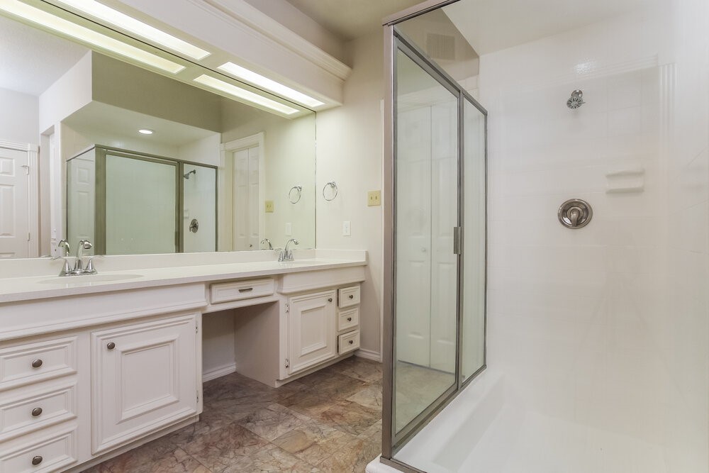 3407 El James Drive Spring, TX 77388 - Photo 11 of 17 a bathroom with a granite countertop sink two mirror and a