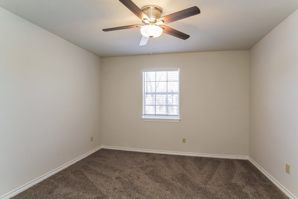 3407 El James Drive Spring, TX 77388 - Photo 12 of 17 an empty room with a window and a fan
