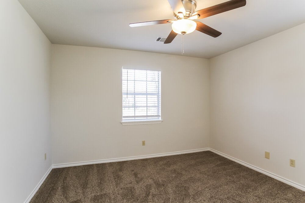 3407 El James Drive Spring, TX 77388 - Photo 13 of 17 an empty room with a window and a fan