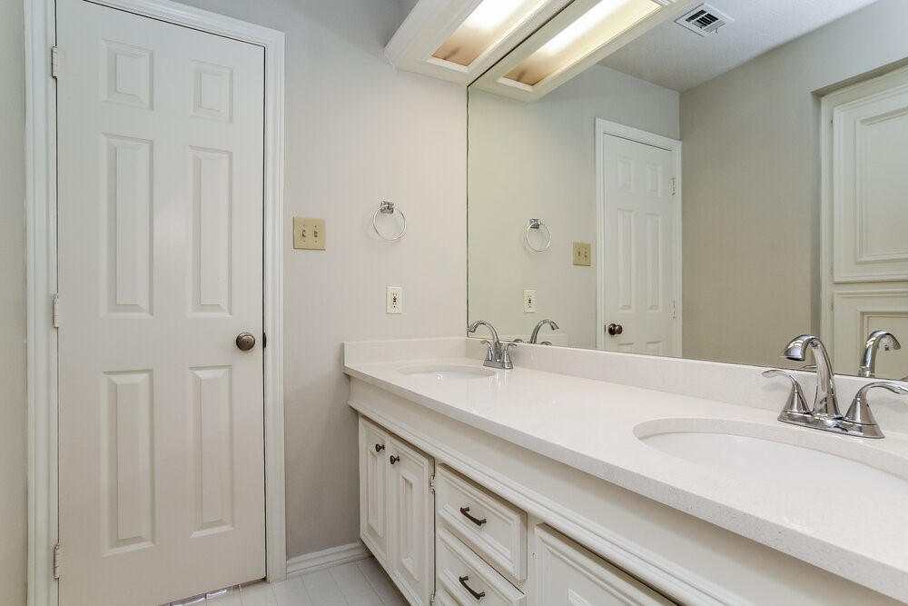 3407 El James Drive Spring, TX 77388 - Photo 15 of 17 a bathroom with a double vanity sink and a mirror