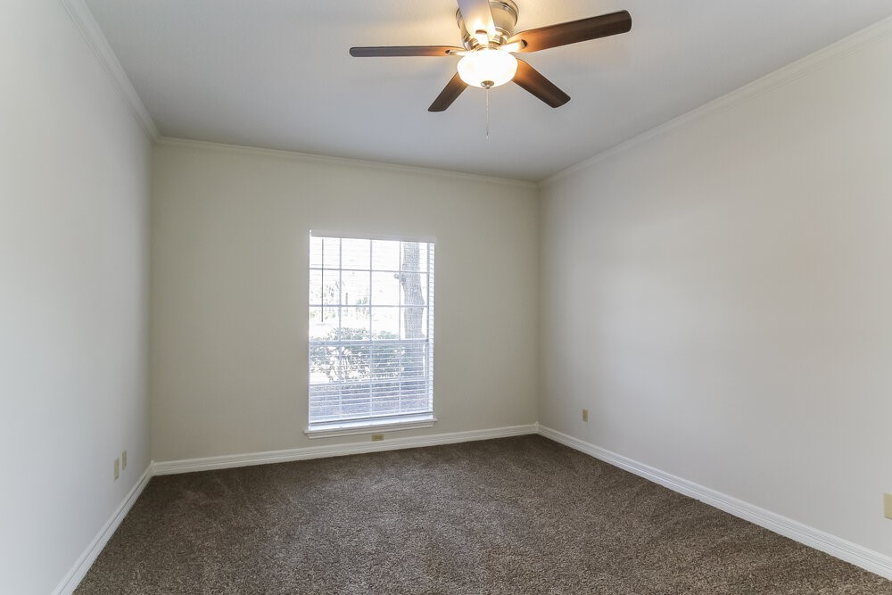 3407 El James Drive Spring, TX 77388 - Photo 9 of 17 an empty room with windows and fan