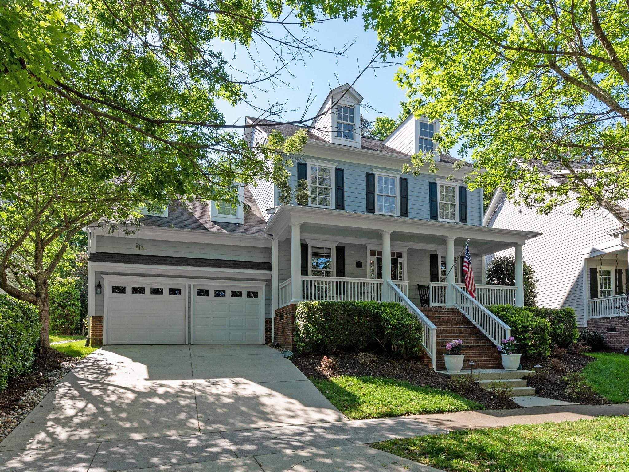 911 Stratford Run Drive Fort Mill, SC 29708 - Photo 1 of 45 a front view of a house with garden