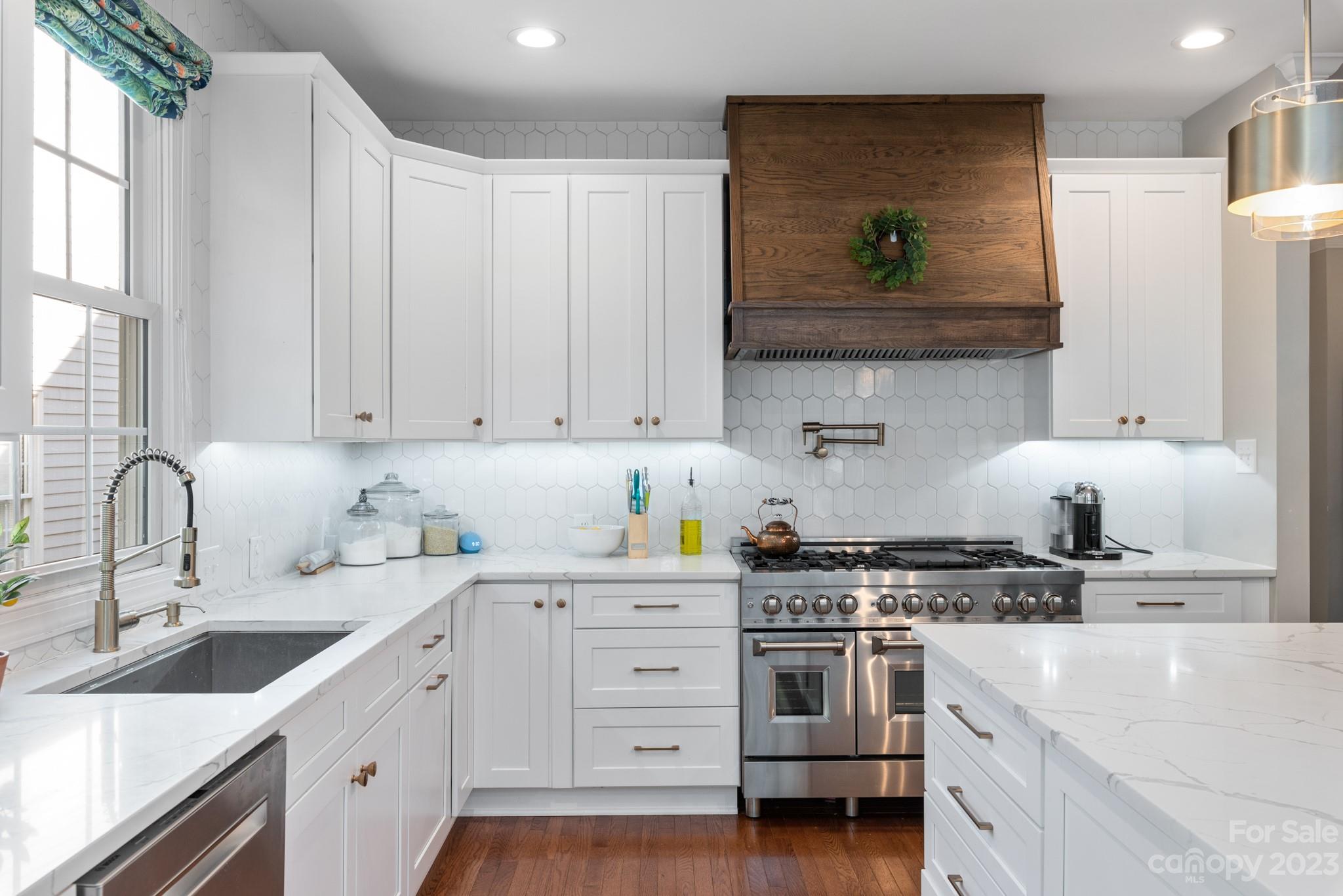 911 Stratford Run Drive Fort Mill, SC 29708 - Photo 19 of 45 a kitchen with cabinets appliances and a sink