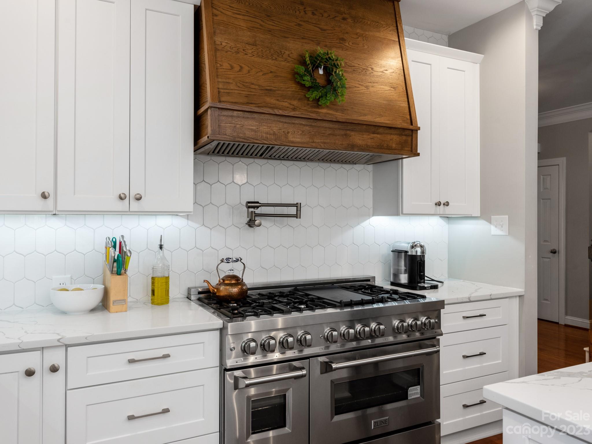 911 Stratford Run Drive Fort Mill, SC 29708 - Photo 20 of 45 a kitchen with stainless steel appliances granite countertop white cabinets and a stove