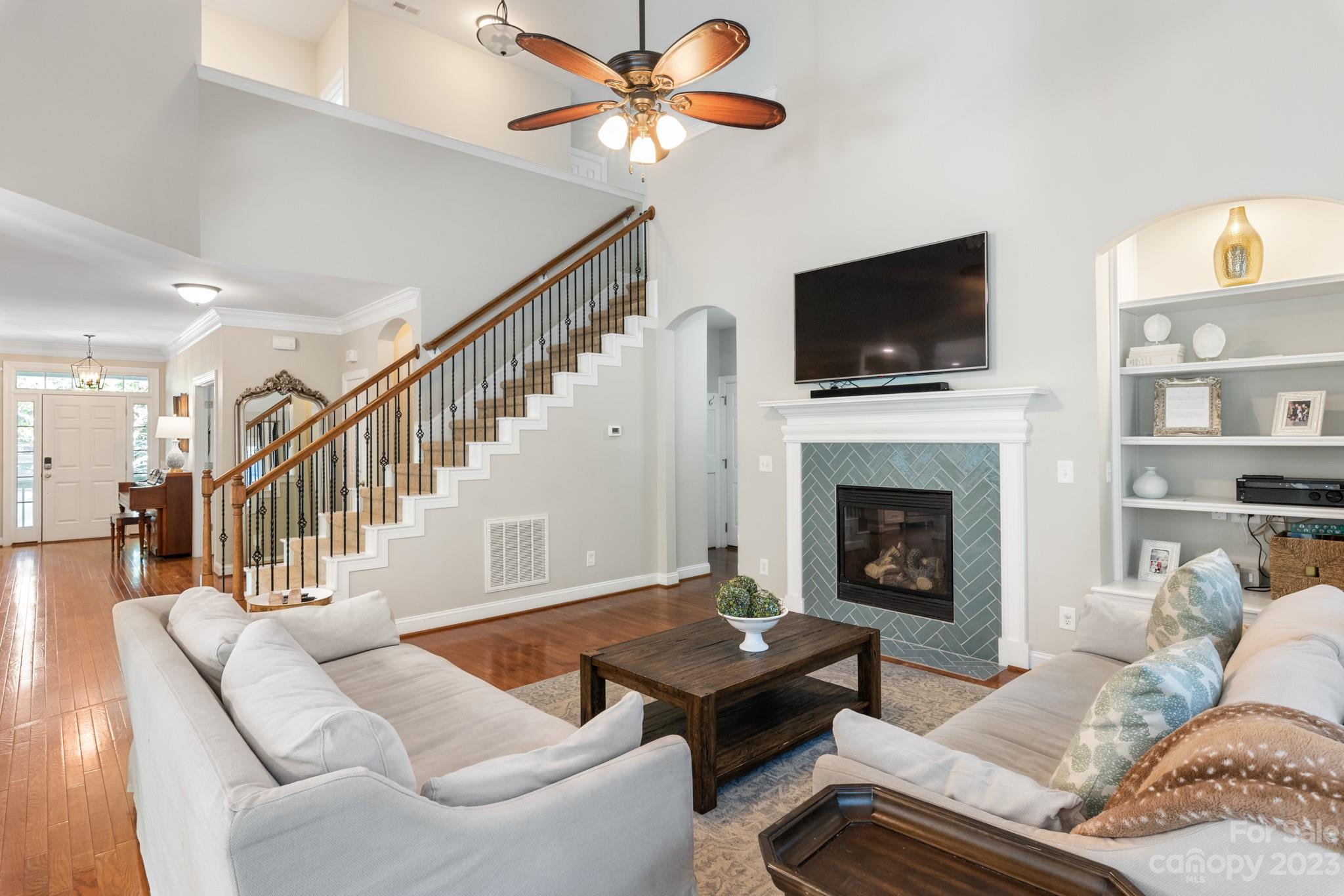 911 Stratford Run Drive Fort Mill, SC 29708 - Photo 23 of 45 a living room with furniture fireplace and a flat screen tv