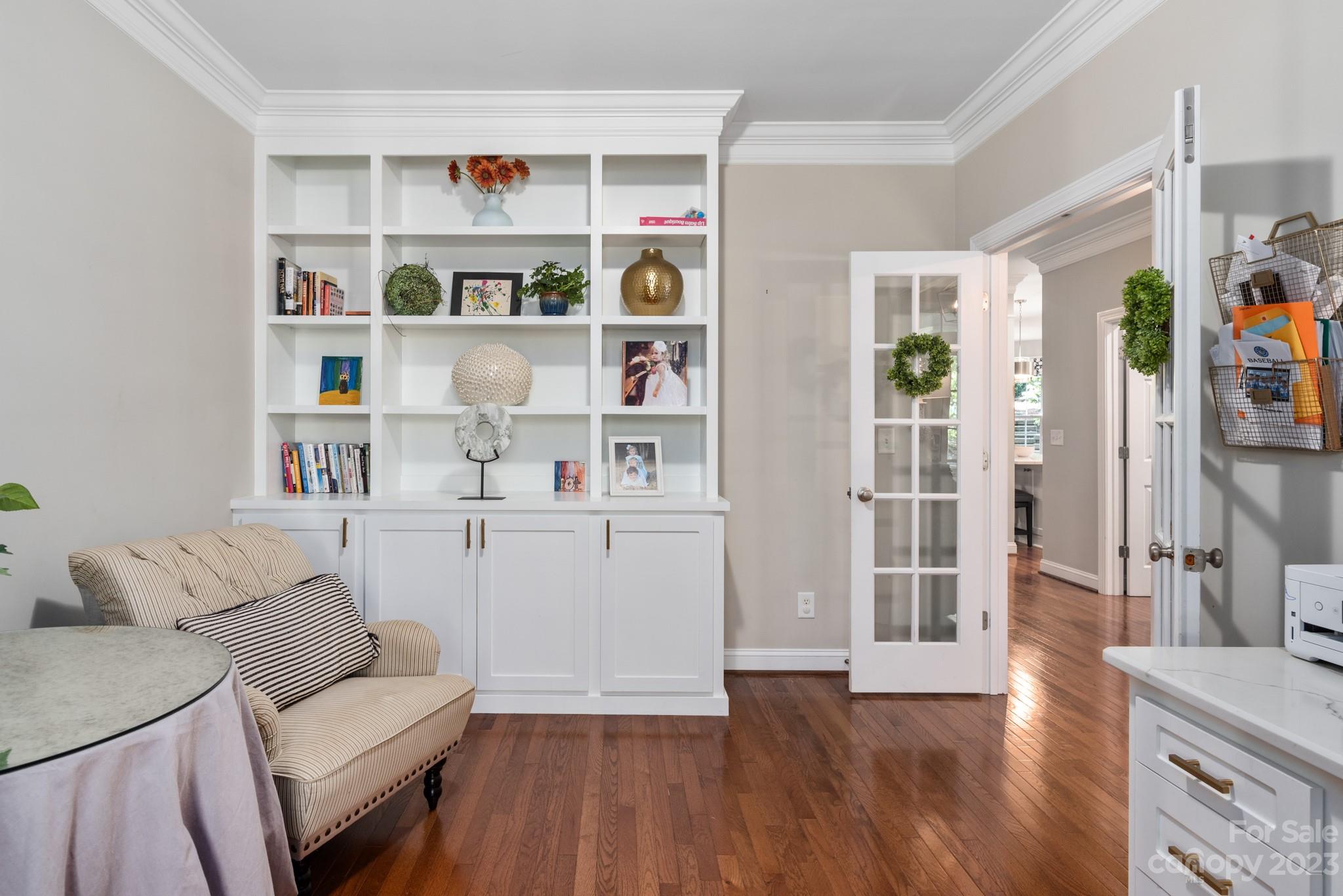 911 Stratford Run Drive Fort Mill, SC 29708 - Photo 27 of 45 a living room with furniture and a book shelf