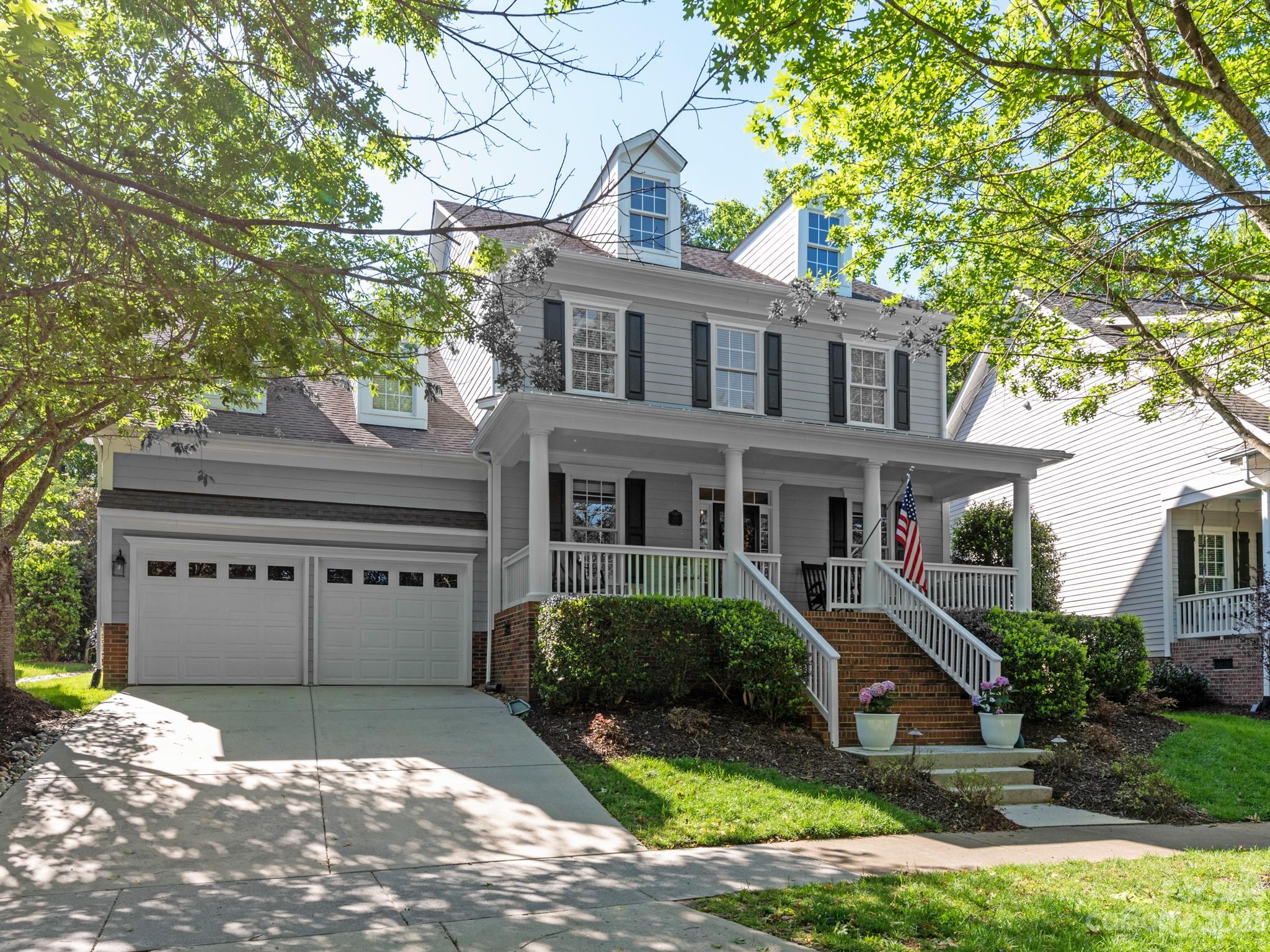 911 Stratford Run Drive Fort Mill, SC 29708 - Photo 3 of 45 a front view of a house with garden