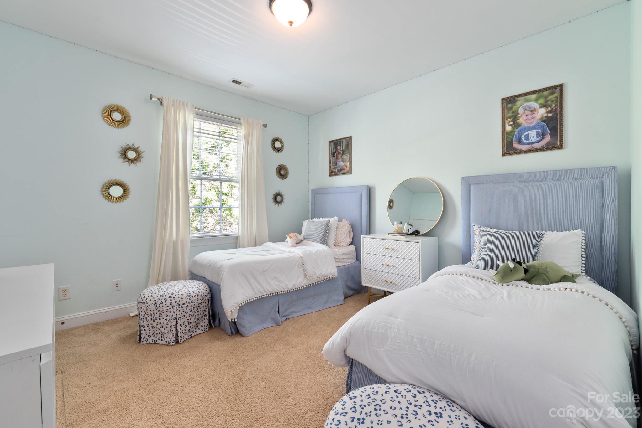 911 Stratford Run Drive Fort Mill, SC 29708 - Photo 36 of 45 a bedroom with two beds and painted walls