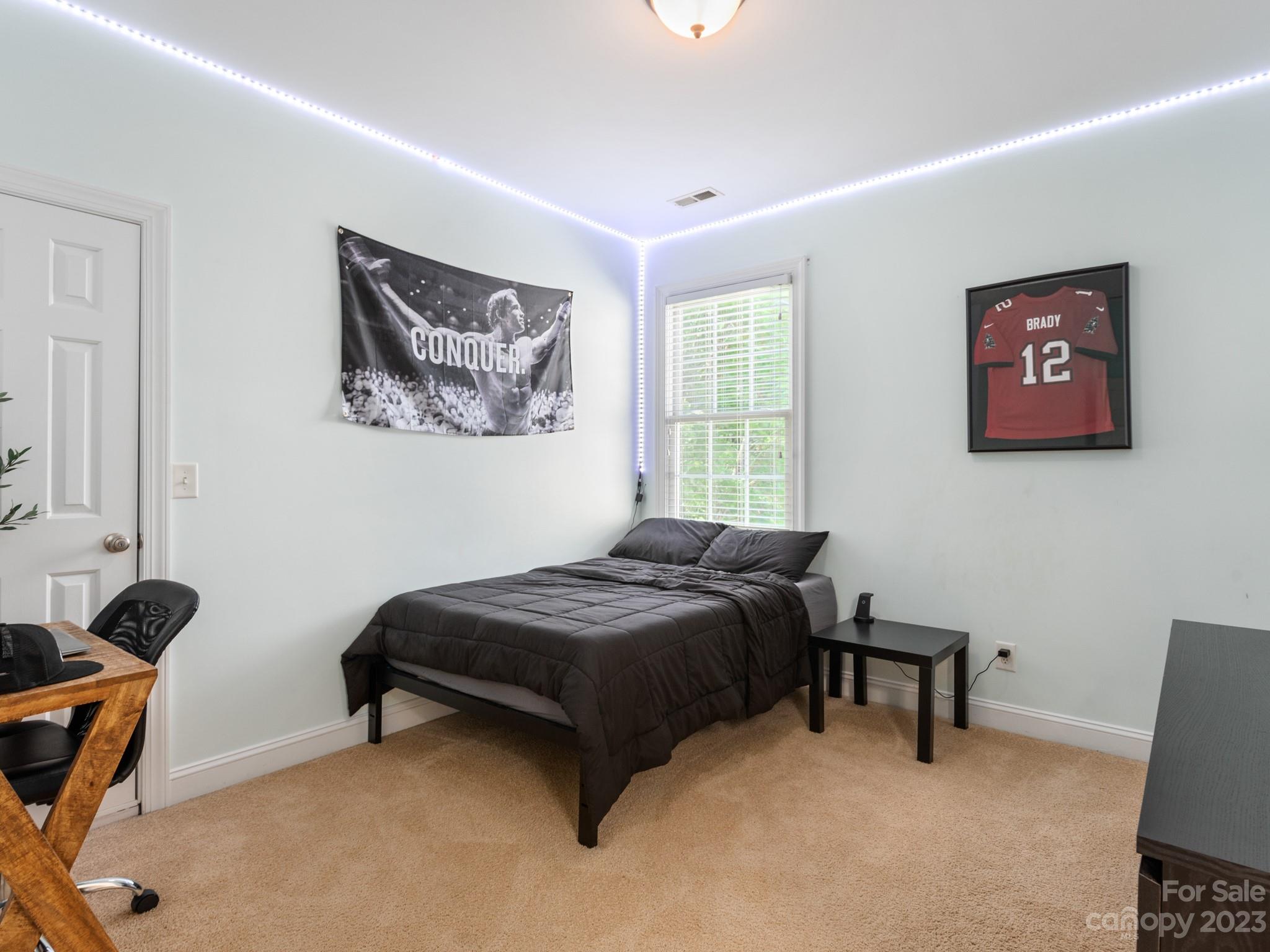 911 Stratford Run Drive Fort Mill, SC 29708 - Photo 40 of 45 a bedroom with a bed and a desk