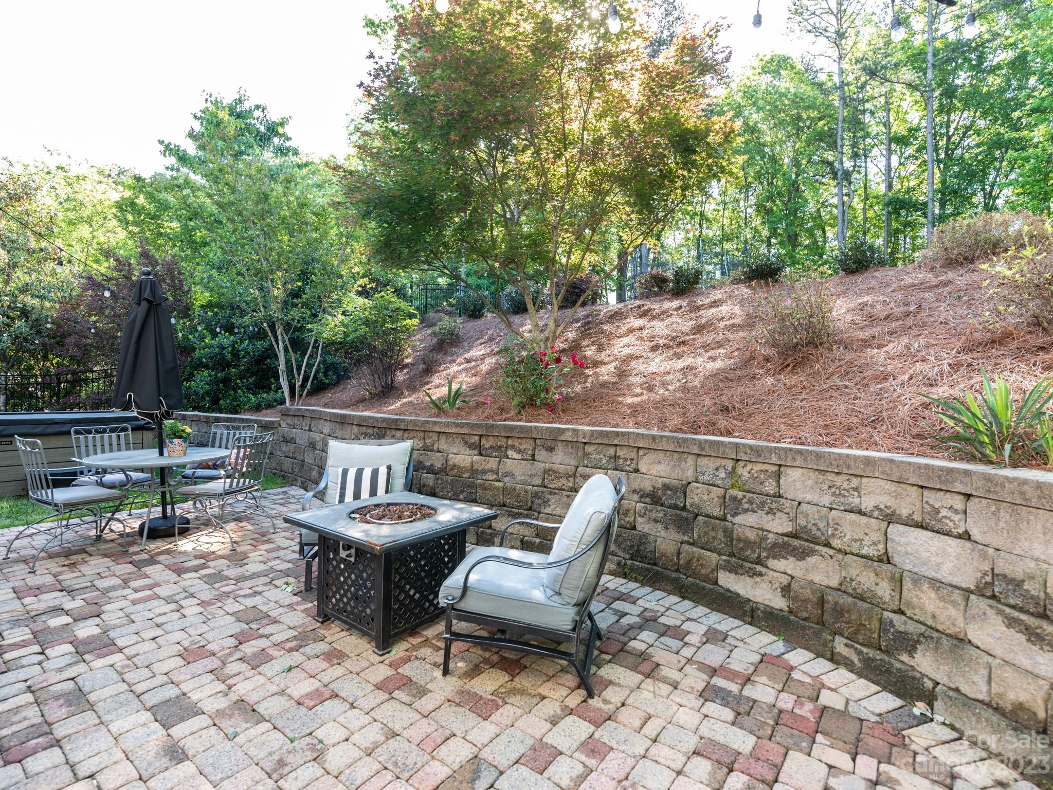 911 Stratford Run Drive Fort Mill, SC 29708 - Photo 42 of 45 a view of a chair and tables in the patio