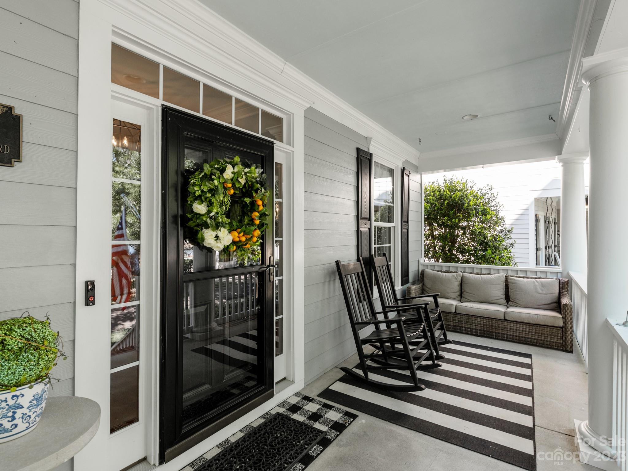 911 Stratford Run Drive Fort Mill, SC 29708 - Photo 6 of 45 a living room with patio furniture and a potted plant