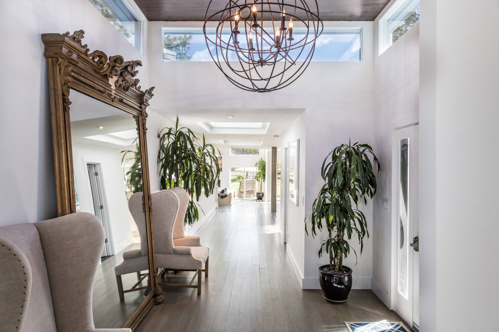 81 Neck Path East Hampton, NY 11937 - Photo 11 of 24 a view of a livingroom with furniture and a potted plant