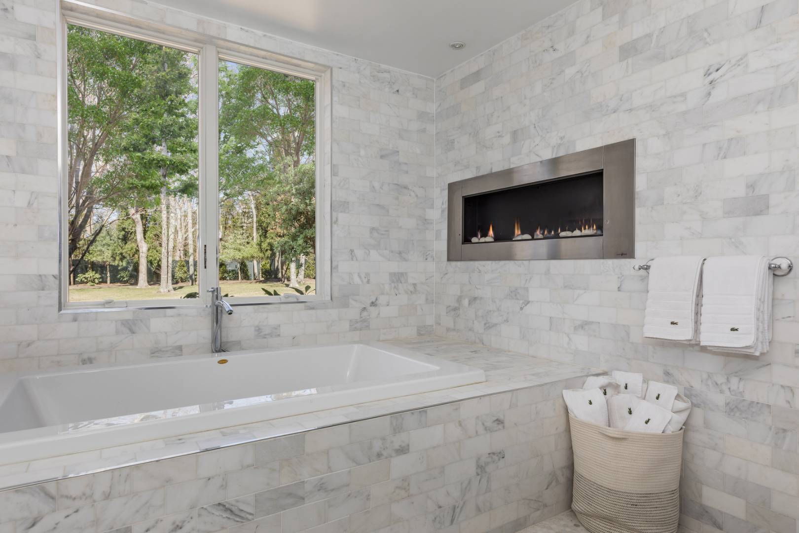 81 Neck Path East Hampton, NY 11937 - Photo 13 of 24 a bathroom with a bathtub and a window