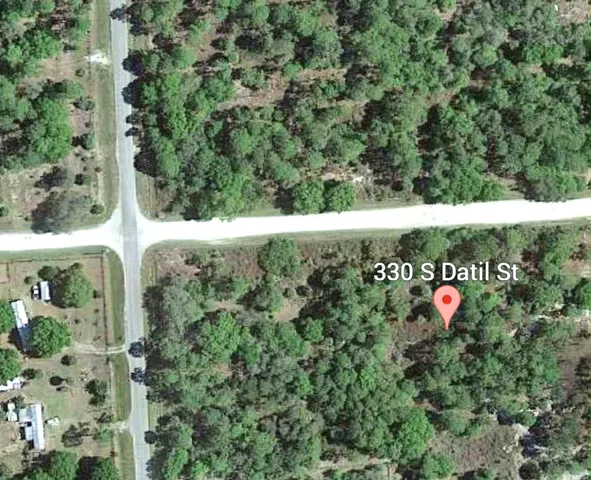 an outdoor space with wooden floor