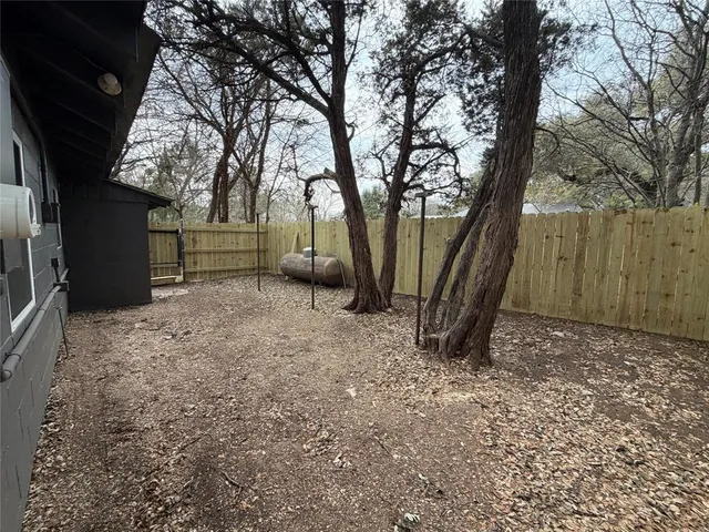 a backyard of a house with lots of green space