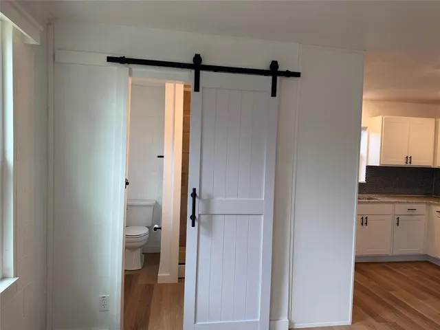 a bathroom with a shower and a sink