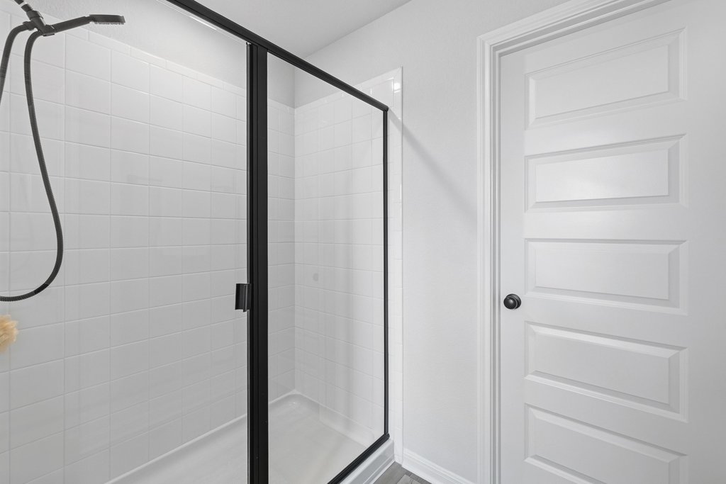 8001 Andravida Drive Austin, TX 78747 - Photo 33 of 35 Modern walk-in shower with convenient closet access