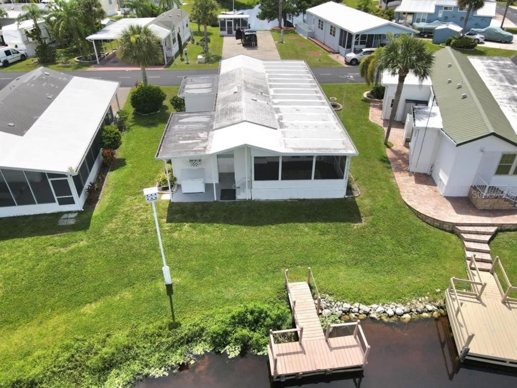 12531 Southeast 140th Avenue, Unit 118 Okeechobee, FL 34974 - Photo 18 of 26 an aerial view of a house with swimming pool garden and patio